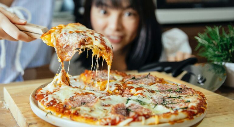 Girl amazed to see the quality of artisan pizza