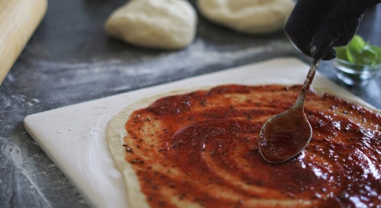 making pizza on the rectangular baking stone