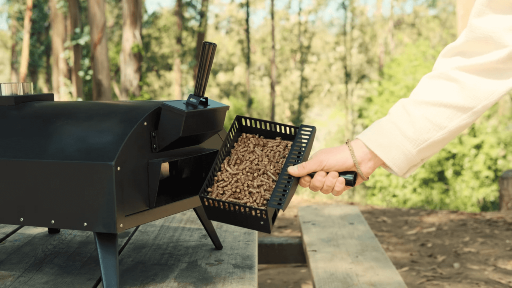 stoke wood powered pizza oven's fuel tray filled with pellets