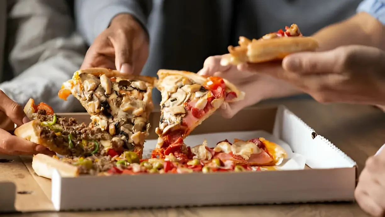 Group of People with Pizza